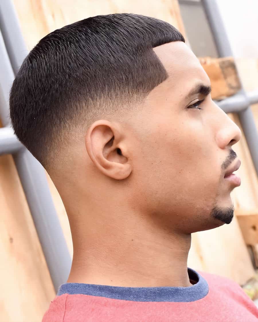 Black man with buzz cut and low skin fade