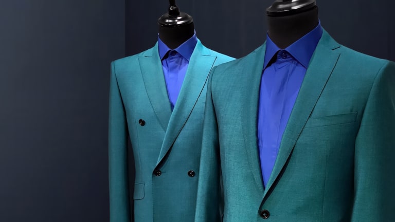 Two turquoise men's mohair suits on mannequins