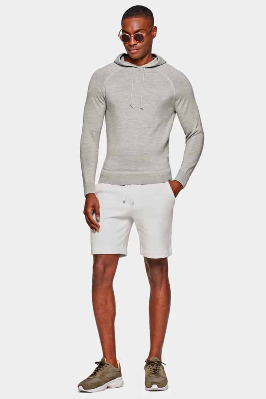 Men's white cotton shorts, grey hoodie and running sneakers outfit