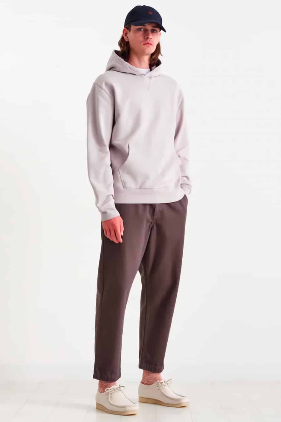 Men's grey chinos, grey hoodie and white Wallabee shoes outfit