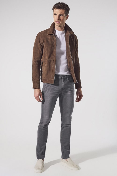 Men's grey jeans, white T-shirt, brown suede jacket and light grey suede loafers outfit