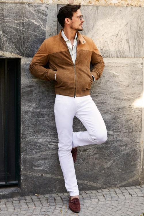 Men's white jeans, grey shirt, tan suede jacket and suede driving shoes outfit