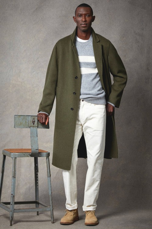 Men's white jeans, striped grey sweatshirt, green overcoat and suede chukka/desert boots outfit