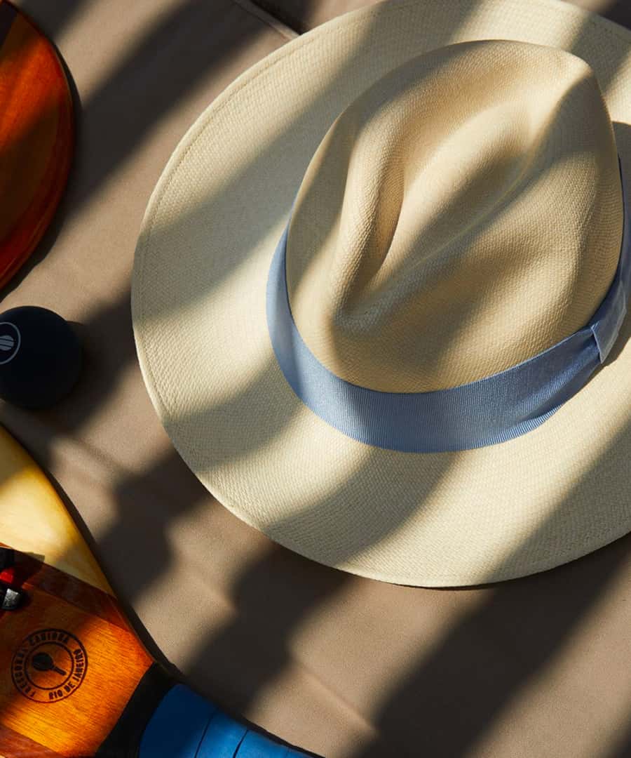 Top down view of a Panama hat with blue ribbon