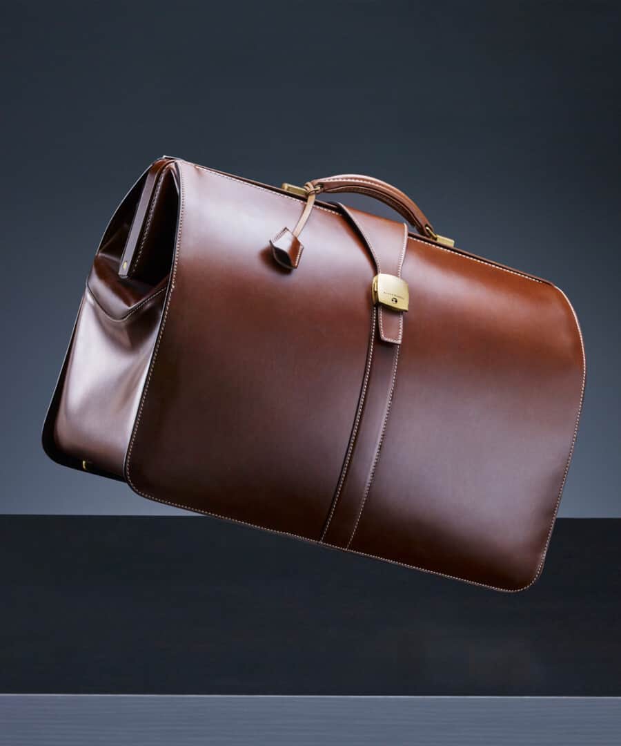 A luxury brown leather weekend bag with gold hardware