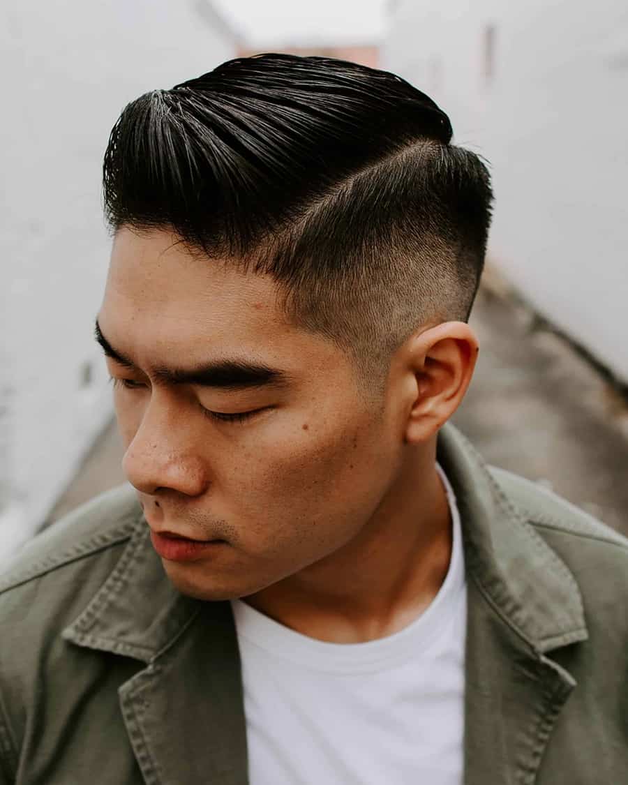 Asian man with slick pompadour haircut and high fade