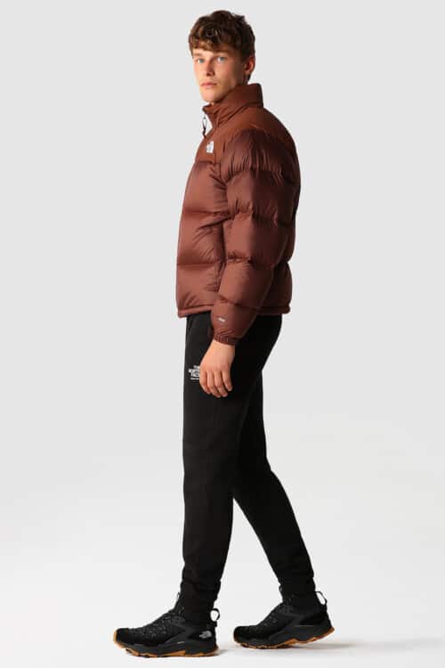 Men's black sweatpants, burgundy puffer jacket and black sneaker boots outfit