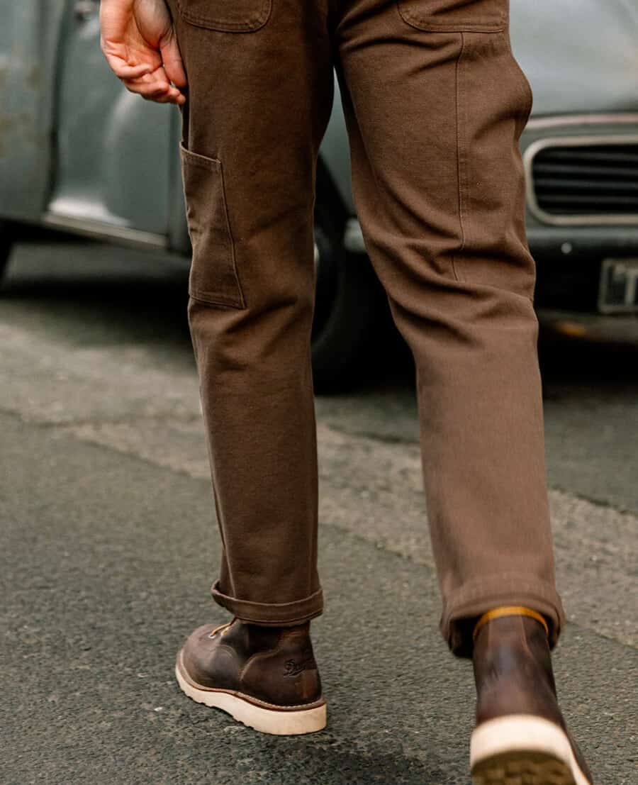 Man wearing brown carpenter pants and brown leather work boots