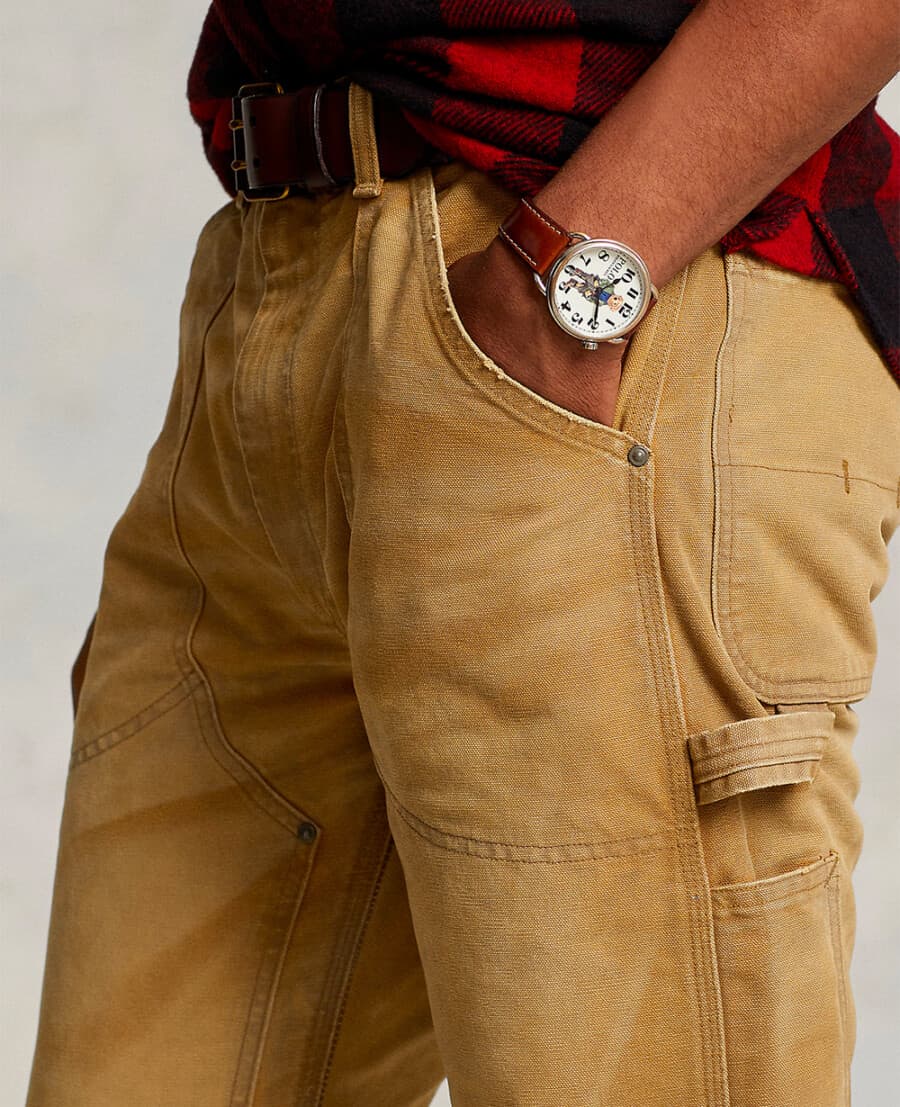 Up close shot of a pair of khaki carpenter pants with tool loop