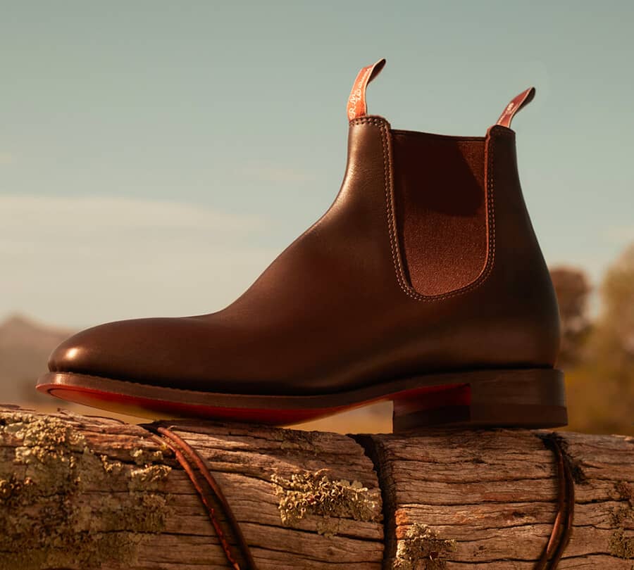 A brown leather work Chelsea boot with a heel that will make you look taller