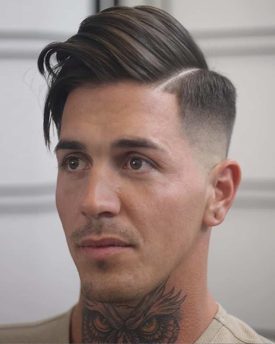 Men's high comb over fade haircut with long hair