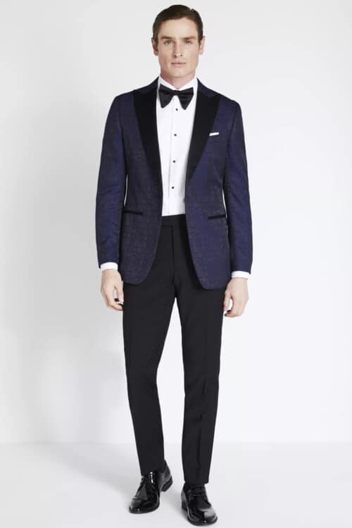 Men's black trousers, white shirt, black bow tie and jacquard dinner jacket outfit for a black tie optional dress code