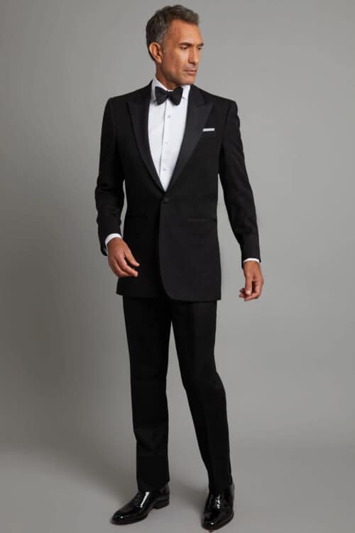 Man wearing black tie attire for a formal wedding