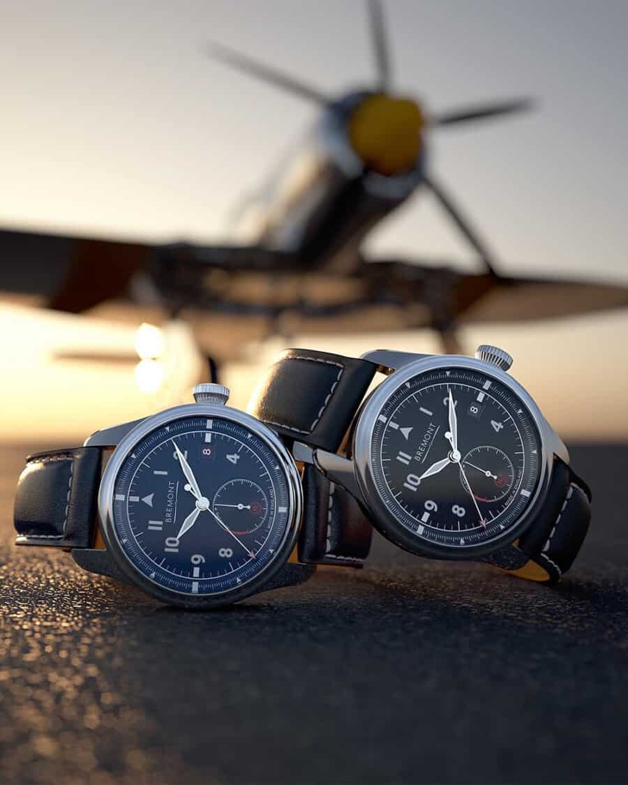 Two Bremont aviator flight watches in front of a propeller plane