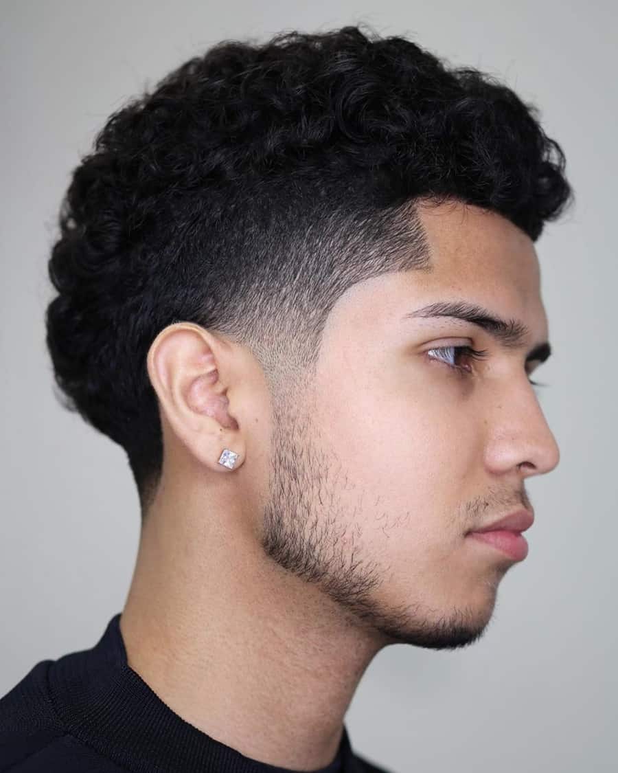 Men's mid length curls with temple fade