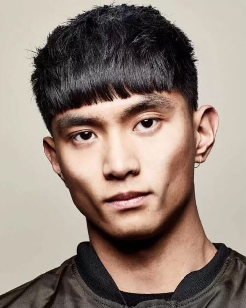 Asian man with black hair sporting a classic mid-length French crop haircut