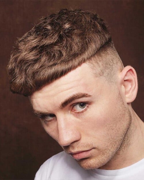 Man with disconnected French crop hairstyle and high fade