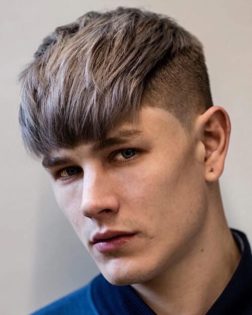 Man with long length French crop hairstyle and undercut