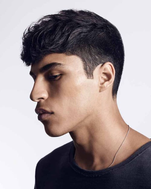 Men's black wavy hair, long length French crop with tapered sides