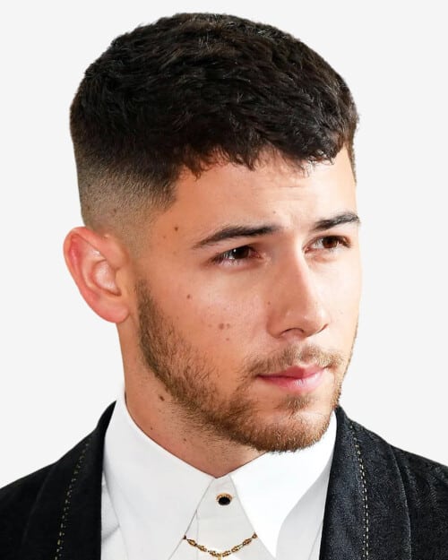 Nick Jonas with a short French crop haircut and high fade