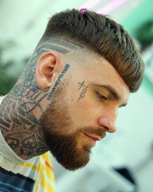 Man with thick French crop haircut and skin fade