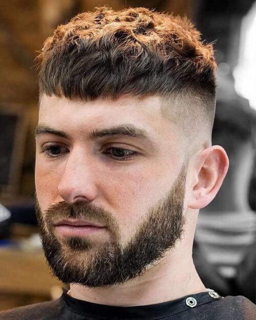 Man with textured French crop haircut and skin fade