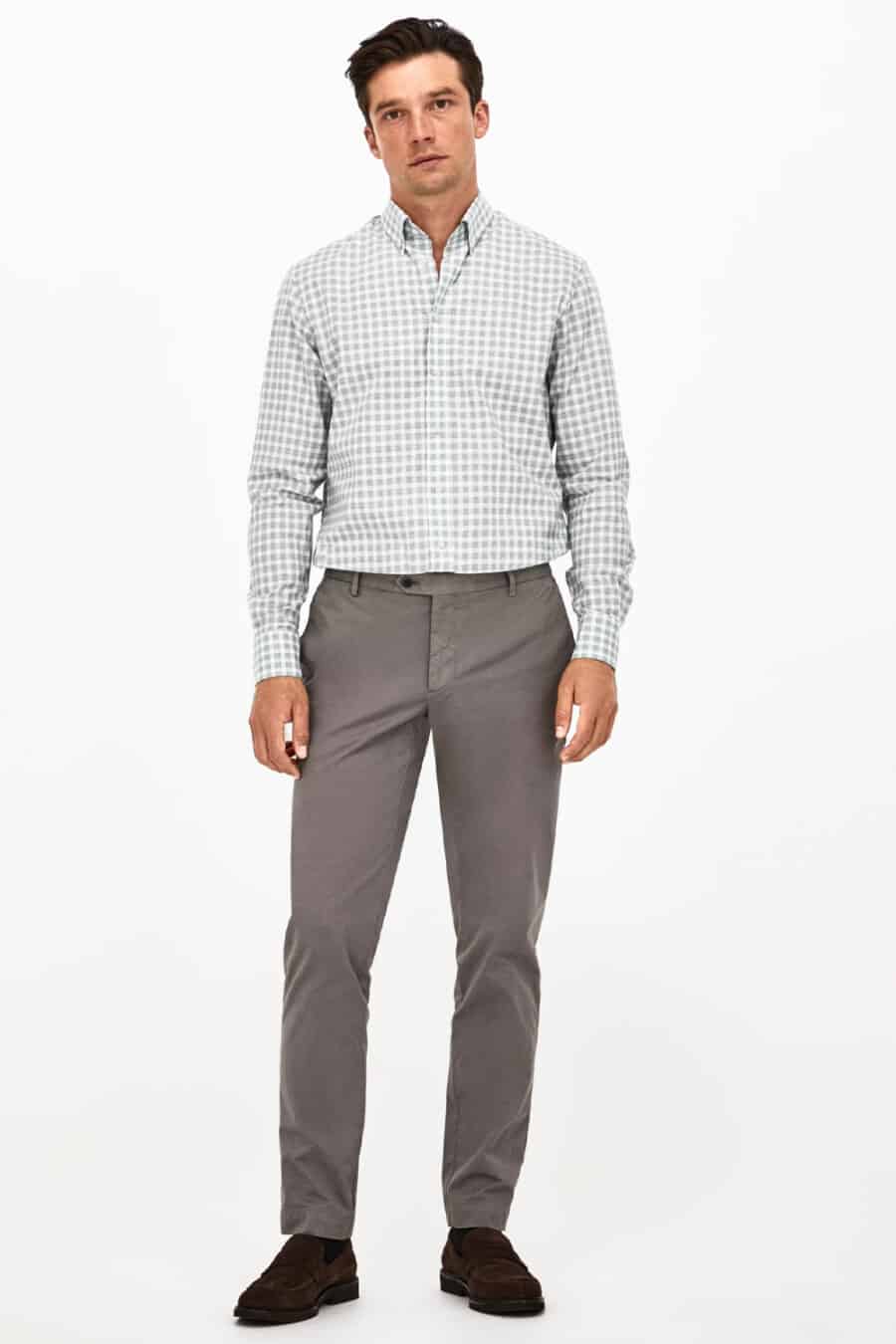 Men's grey chinos, green and white gingham shirt and brown suede loafers outfit
