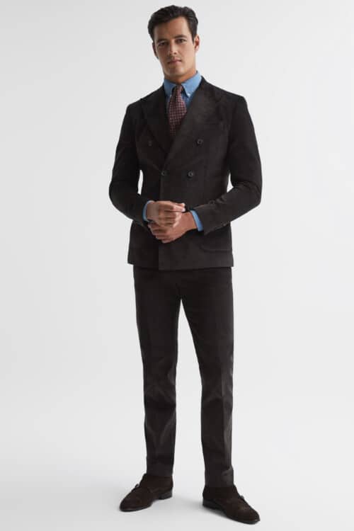 Men's double breasted brown corduroy suit outfit worn with a denim shirt and red tie