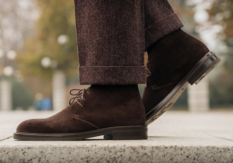 Man wearing dark brown suede chukka/desert boots with brown woll pants