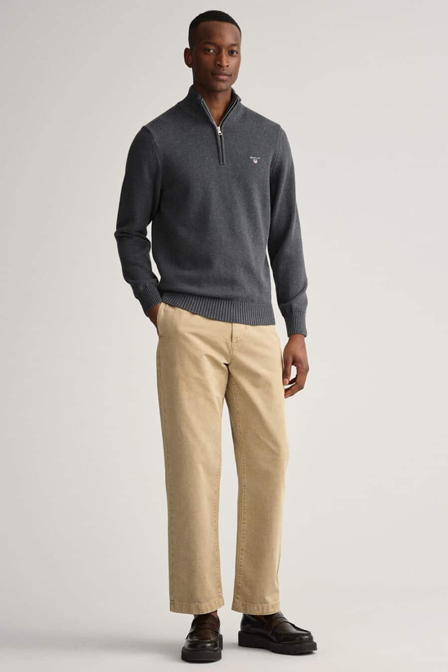 Men's relaxed khaki pants, charcoal quarter-zip sweater and chunky loafers outfit