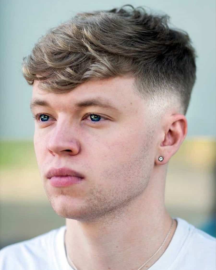Natural mop hairstyle with drop fade