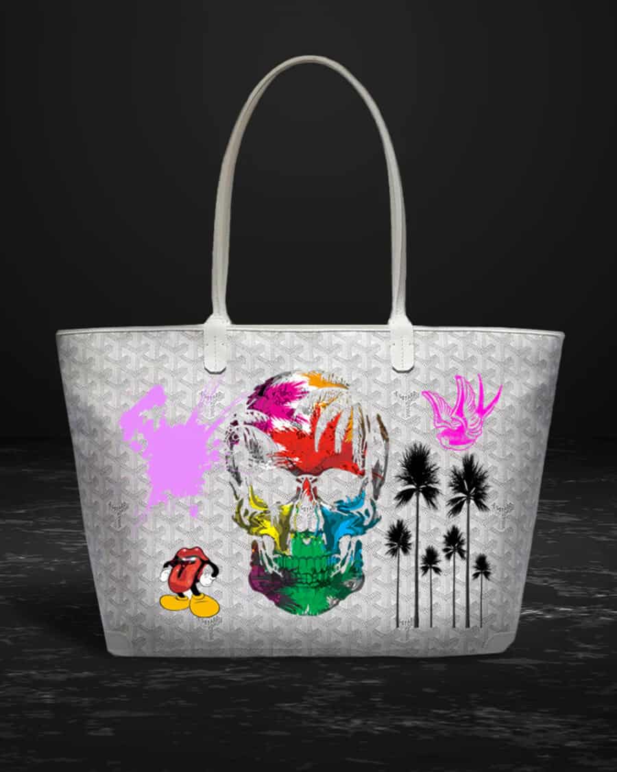 A Philip Karto luxury Goyard tote bag customised with skull graphic