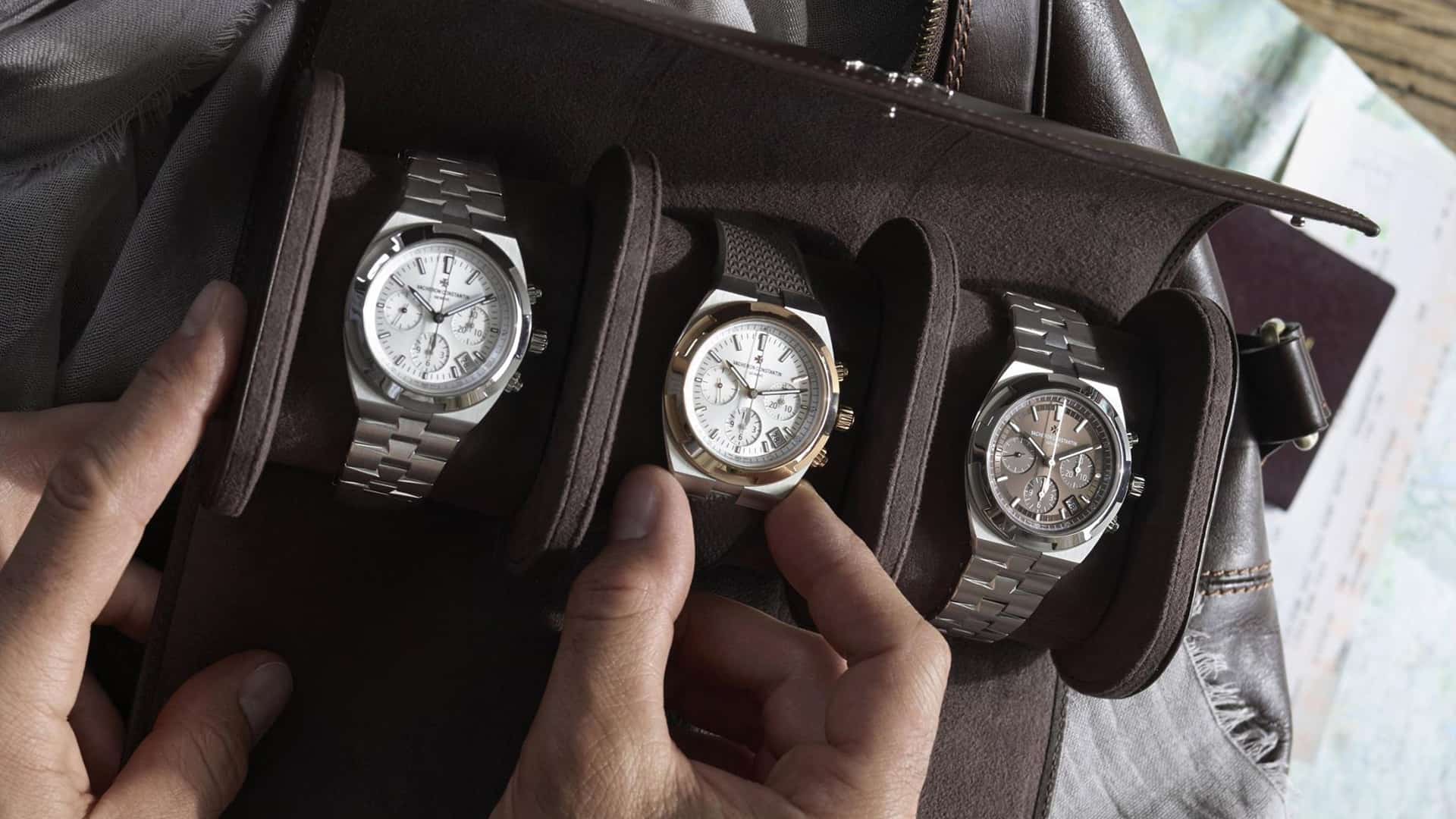 Man with a watch roll with 3 mechanical watches in it