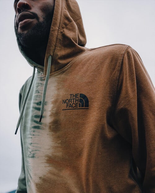 Close up of a branded gradient North Face hoodie