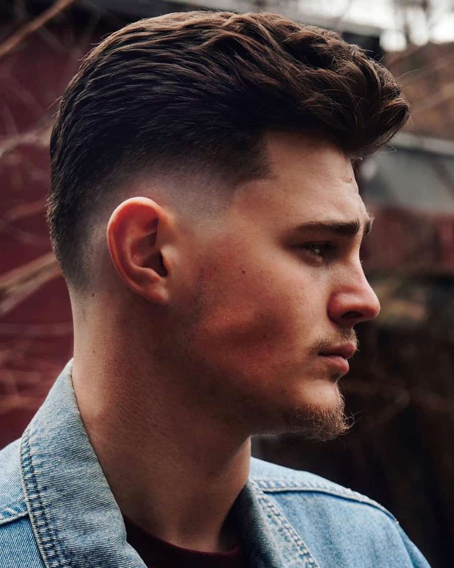 Men's modern pompadour hairstyle with drop fade