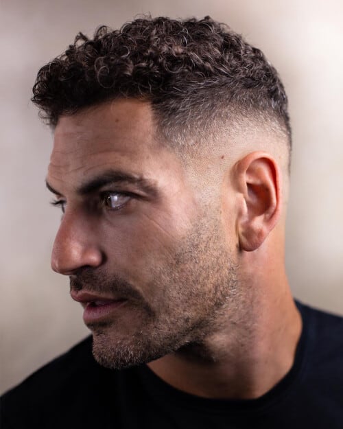 Men's short back and sides wavy haircut with high skin fade