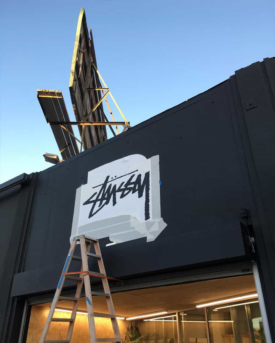Stussy storefront being painted with the iconic scrawl signature logo