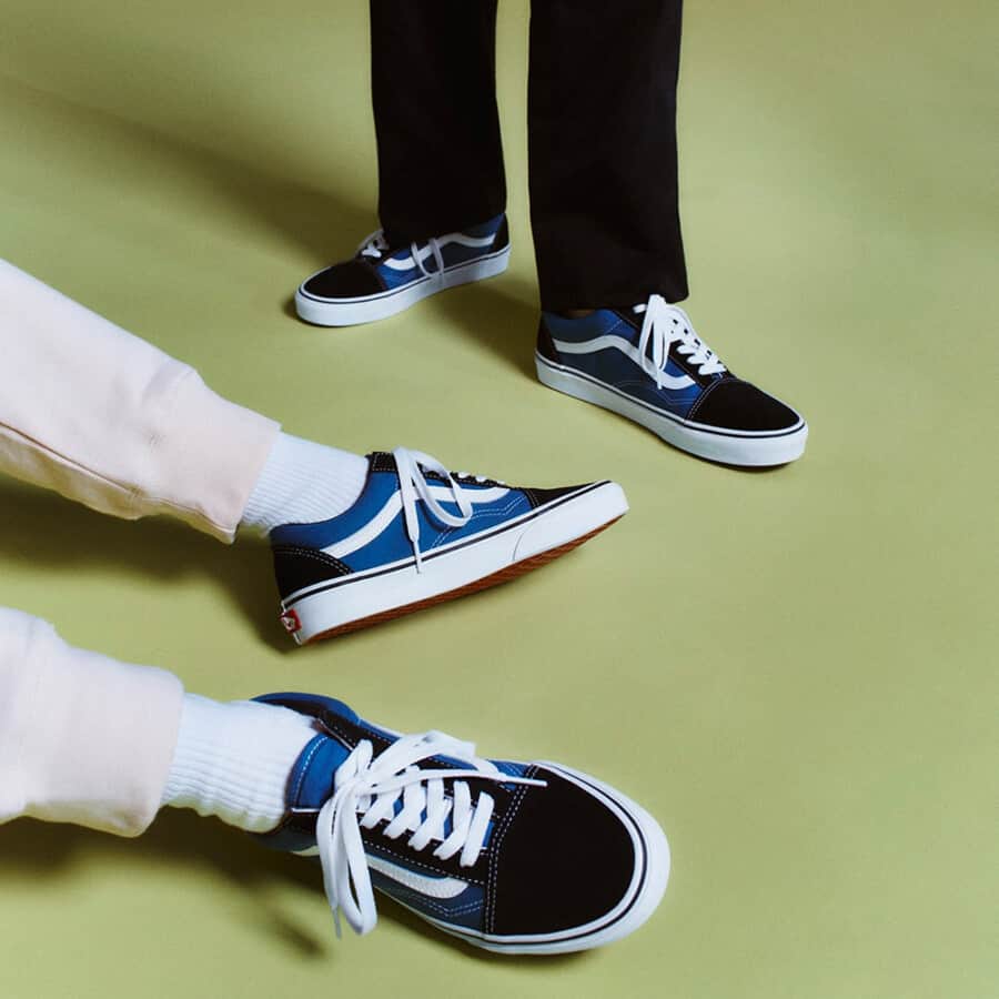 Cheap men's Vans Old Skool classic sneakers in black, blue and white colourway worn on feet