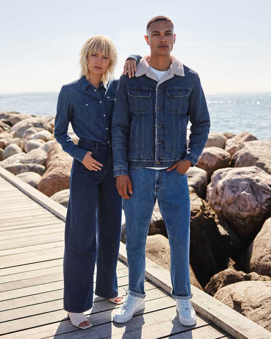 Man and women wearing affordable double denim outfit of jeans and jean jacket by Lee