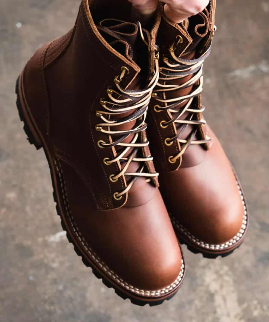 A pair of handmade brown leather work boots, produced in the USA