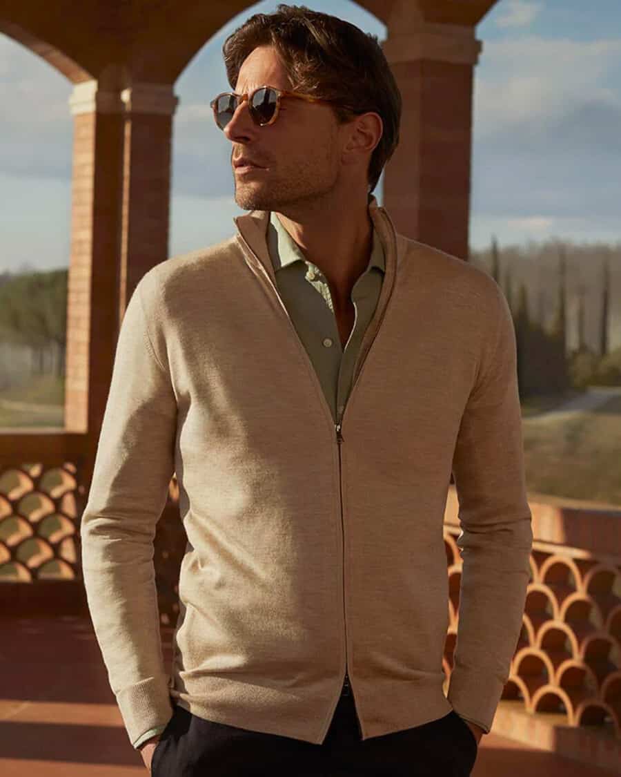 Men's soft cotton chinos, green linen shirt and cashmere zip up cardigan luxury travel outfit