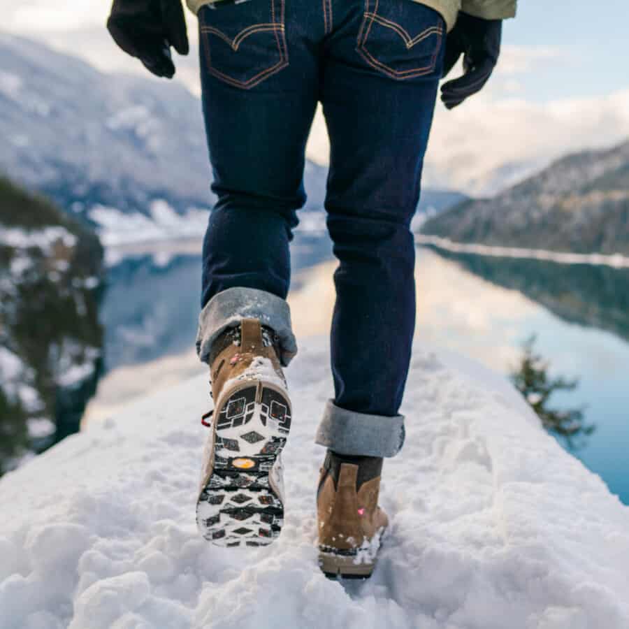 Man walking in snow wearing waterproof work boots