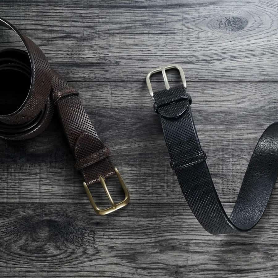 Two luxury pitted leather men's belts in dark brown and black