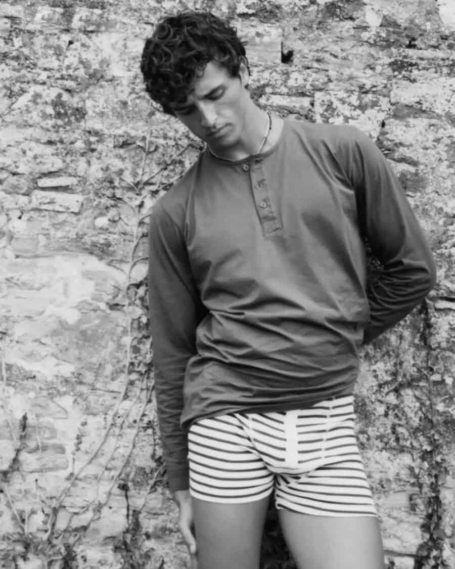 Man wearing a luxury Hemen Biarritz henley top and striped boxer shorts
