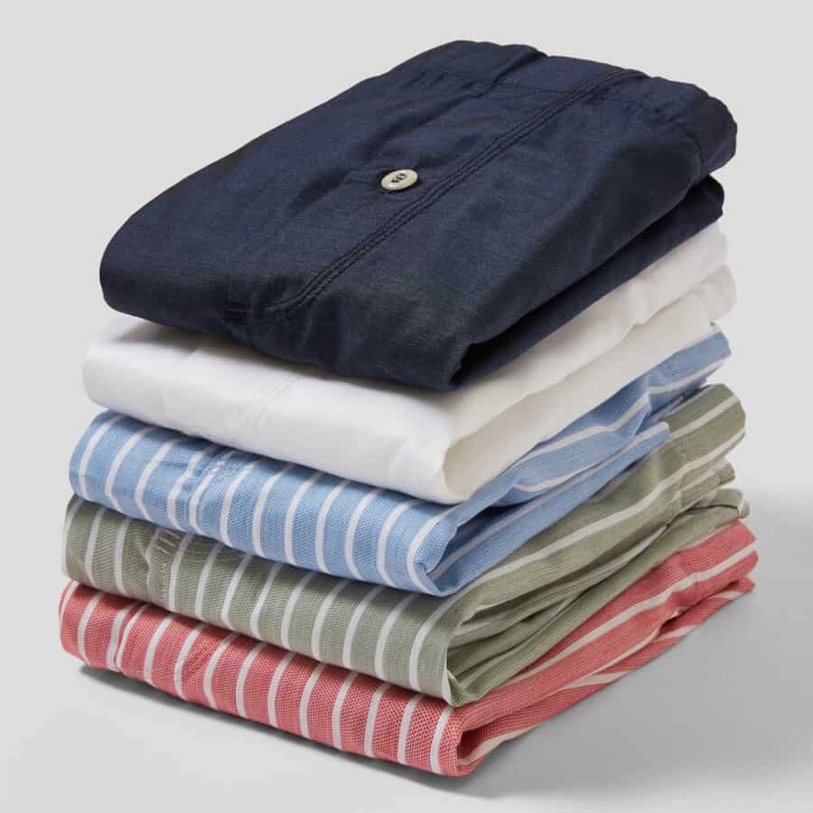 A stack of luxury men's boxer shorts in a variety of colous and stripes