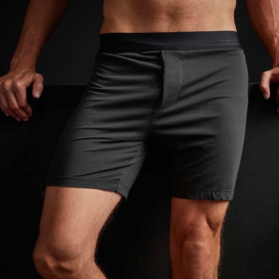Man wearing luxury long length black boxer shorts by James Perse