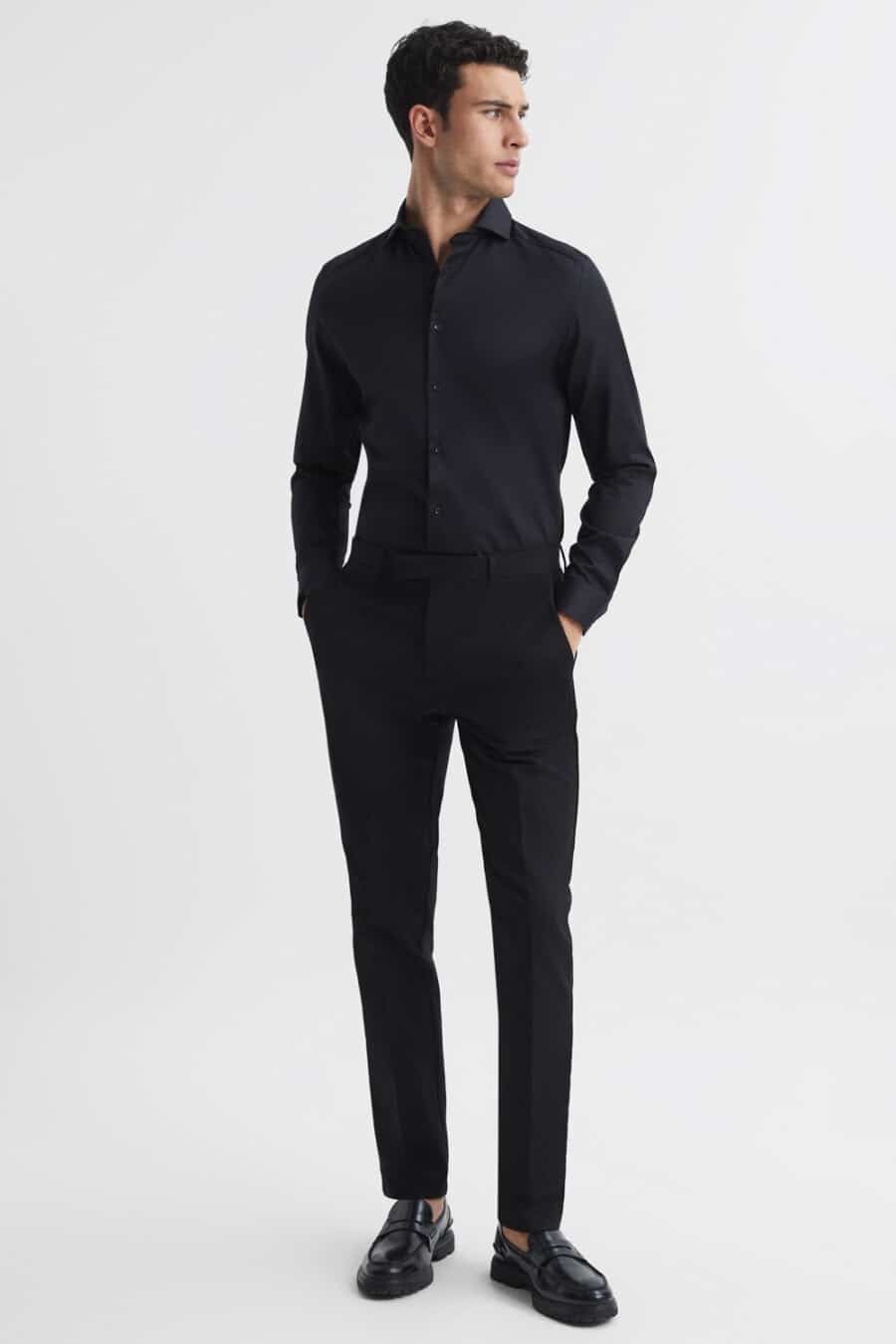 Men's black pants, black dress shirt and black leather penny loafers outfit