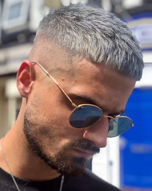 Men's silver hair Caesar cut with a high skin fade
