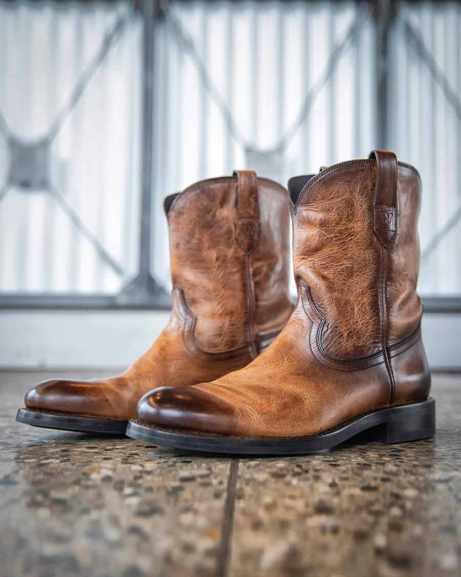 Pair of men's tan leather western work boots by Wolverine