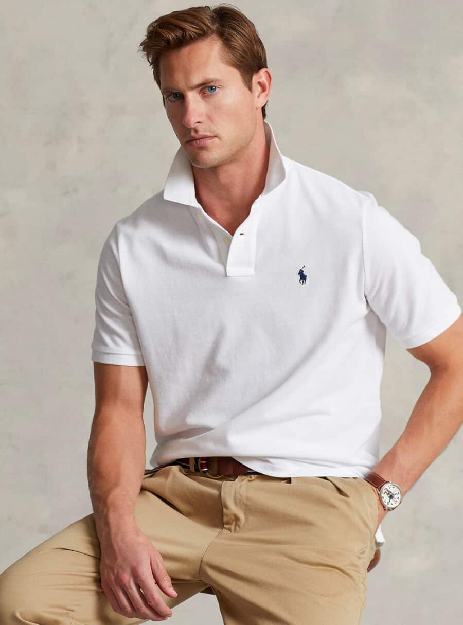 Man wearing a white Ralph Lauren pony polo shirt with khaki pants